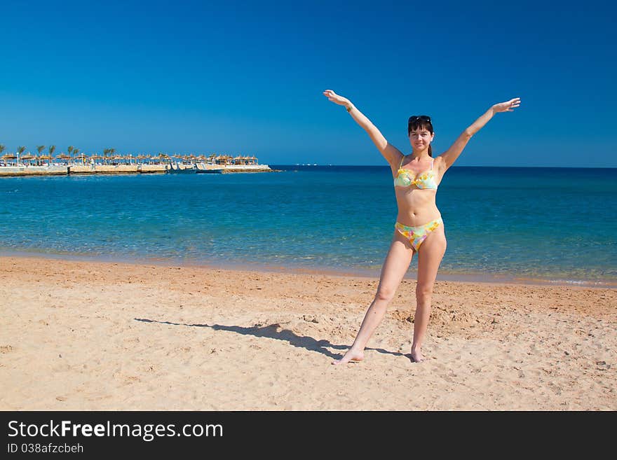 Beautiful  woman on sea with beach. Nature