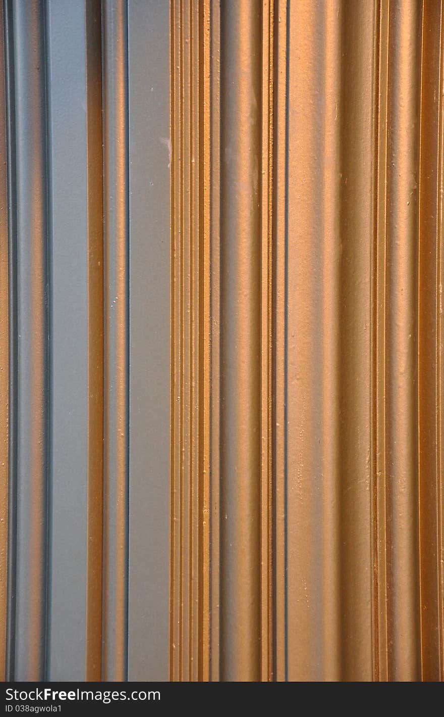 A copper and gray vertical striped pattern. A copper and gray vertical striped pattern