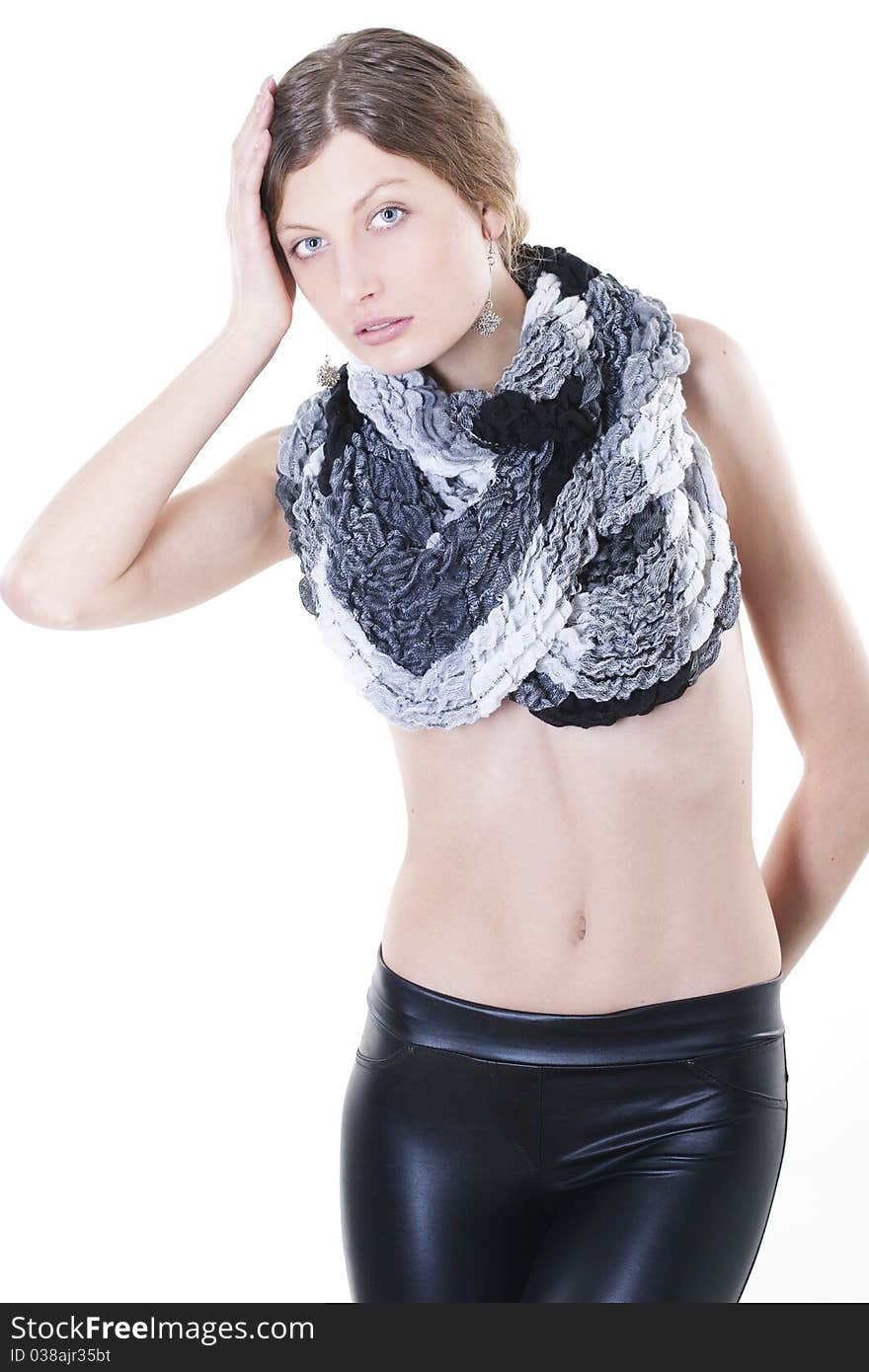 Fashion model posing in leggings and a scarf