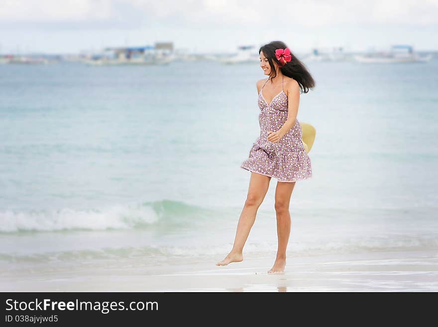 Young attractive woman on beach