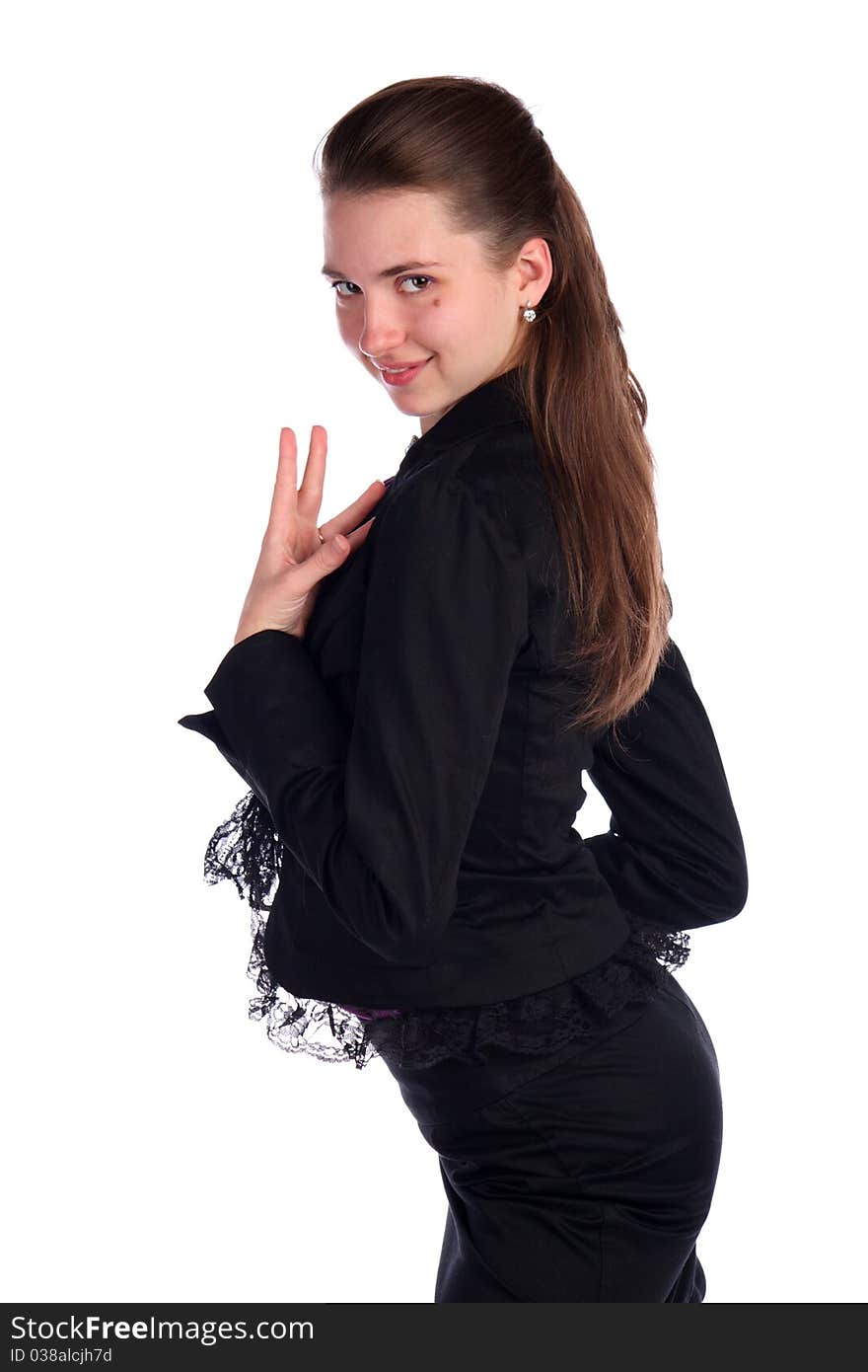 Girl in black suit posing side-view. Isolated on white.