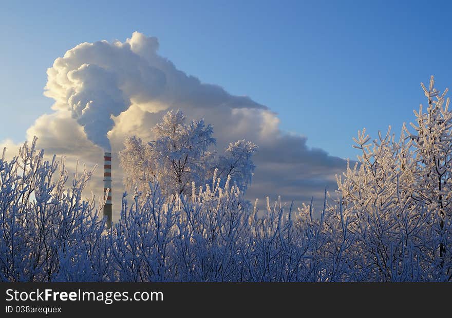 Smoke from the chimney of the gas thermal power station on a frosty day