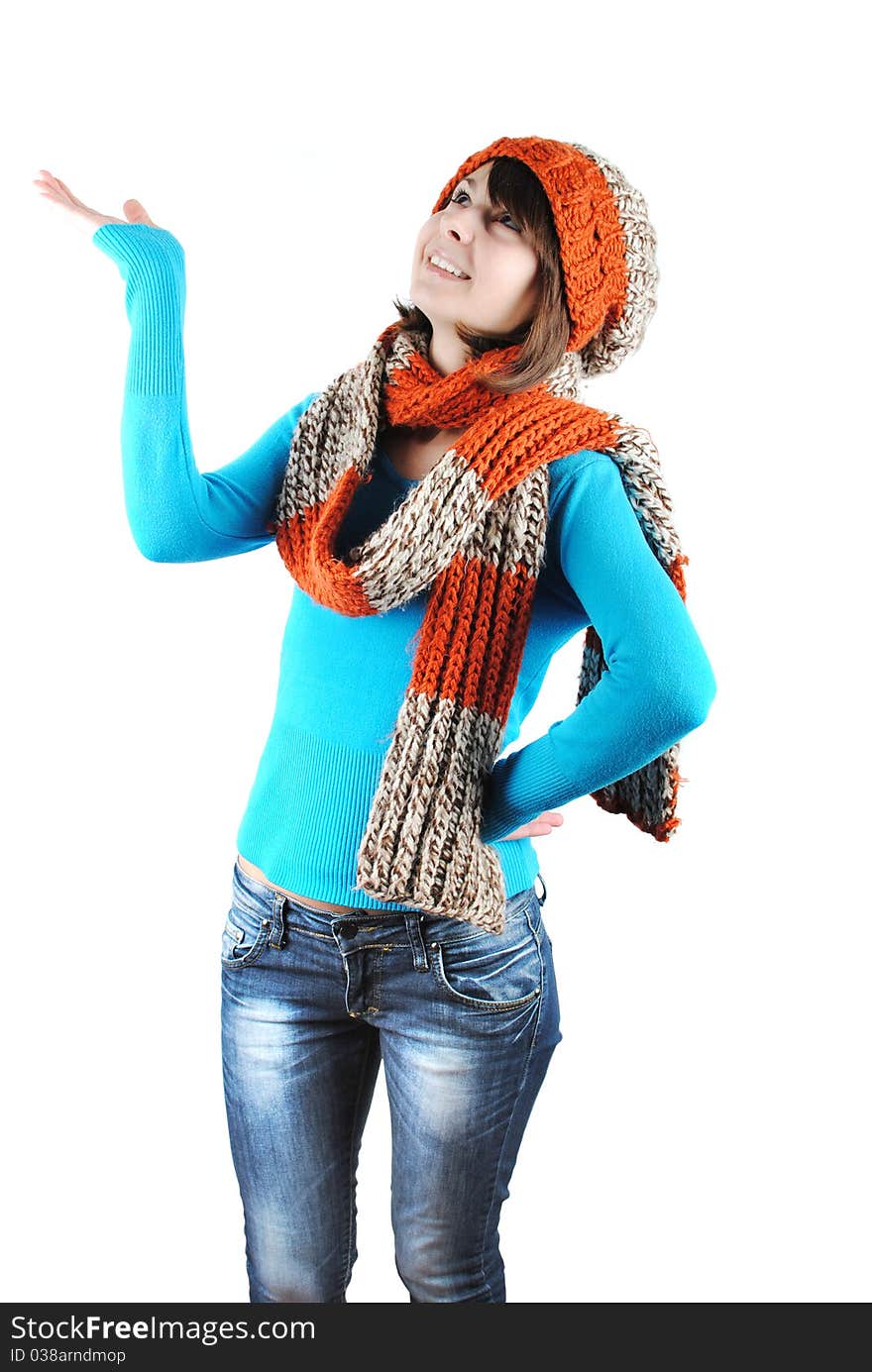 Happy beautiful girl wearing a hat and scarf isolated against white background