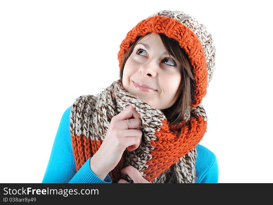 Happy beautiful girl wearing a hat and scarf isolated against white background