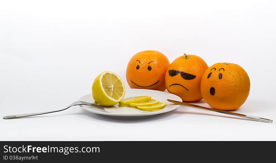 Oranges with a plate with knife and fork and lemon. Oranges with a plate with knife and fork and lemon