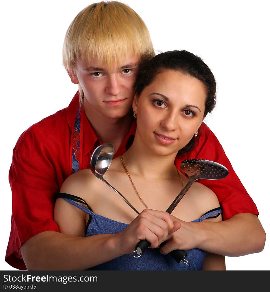 Young man and woman embraces with utensil. Isolated.