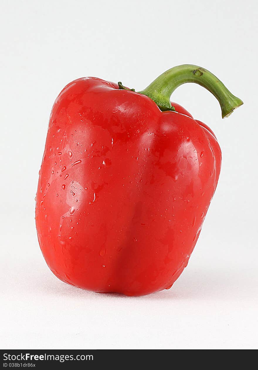 Big red paprika isolated on white background