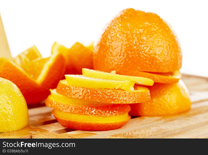 Slices of on orange and lemon mixed together. Slices of on orange and lemon mixed together