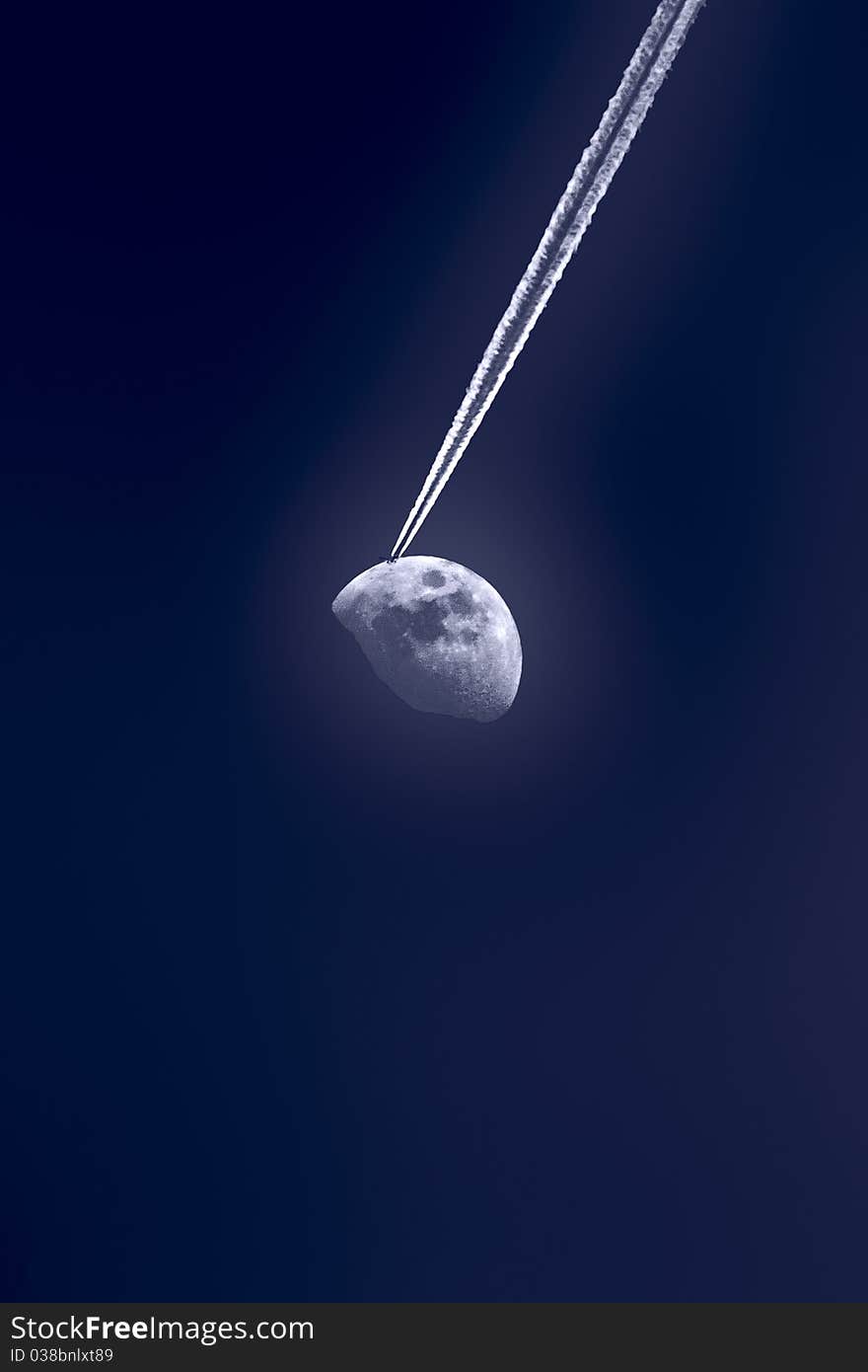 An illusion of an aeroplane flying towards the moon. An illusion of an aeroplane flying towards the moon.