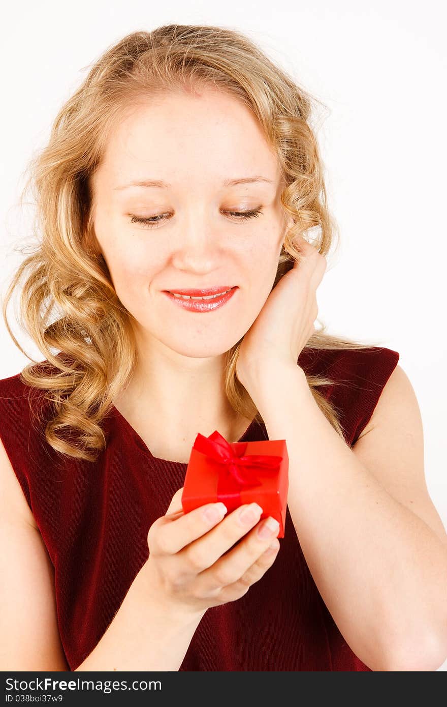 Woman with a gift on a white background