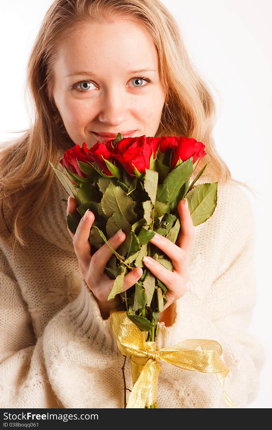 Woman with the bouquet of red roses