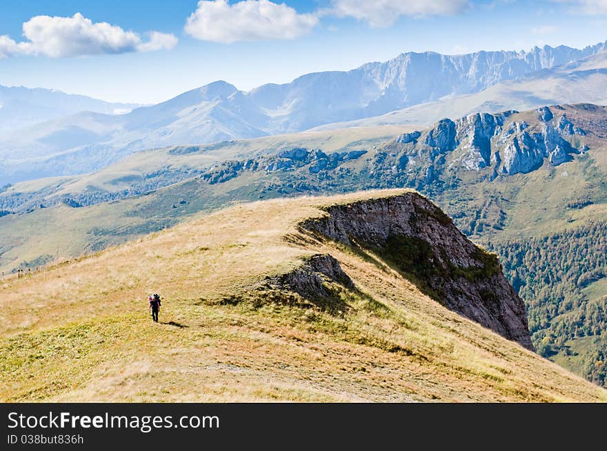 Man hiking in mountain with backpack