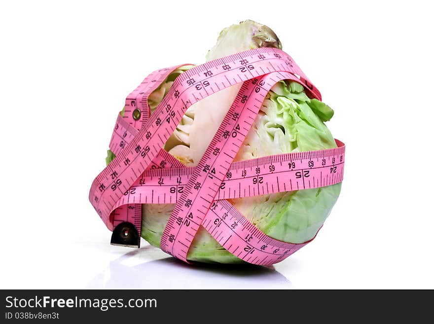 Cabbage wrapped in measuring tape isolated on white background. Cabbage wrapped in measuring tape isolated on white background.