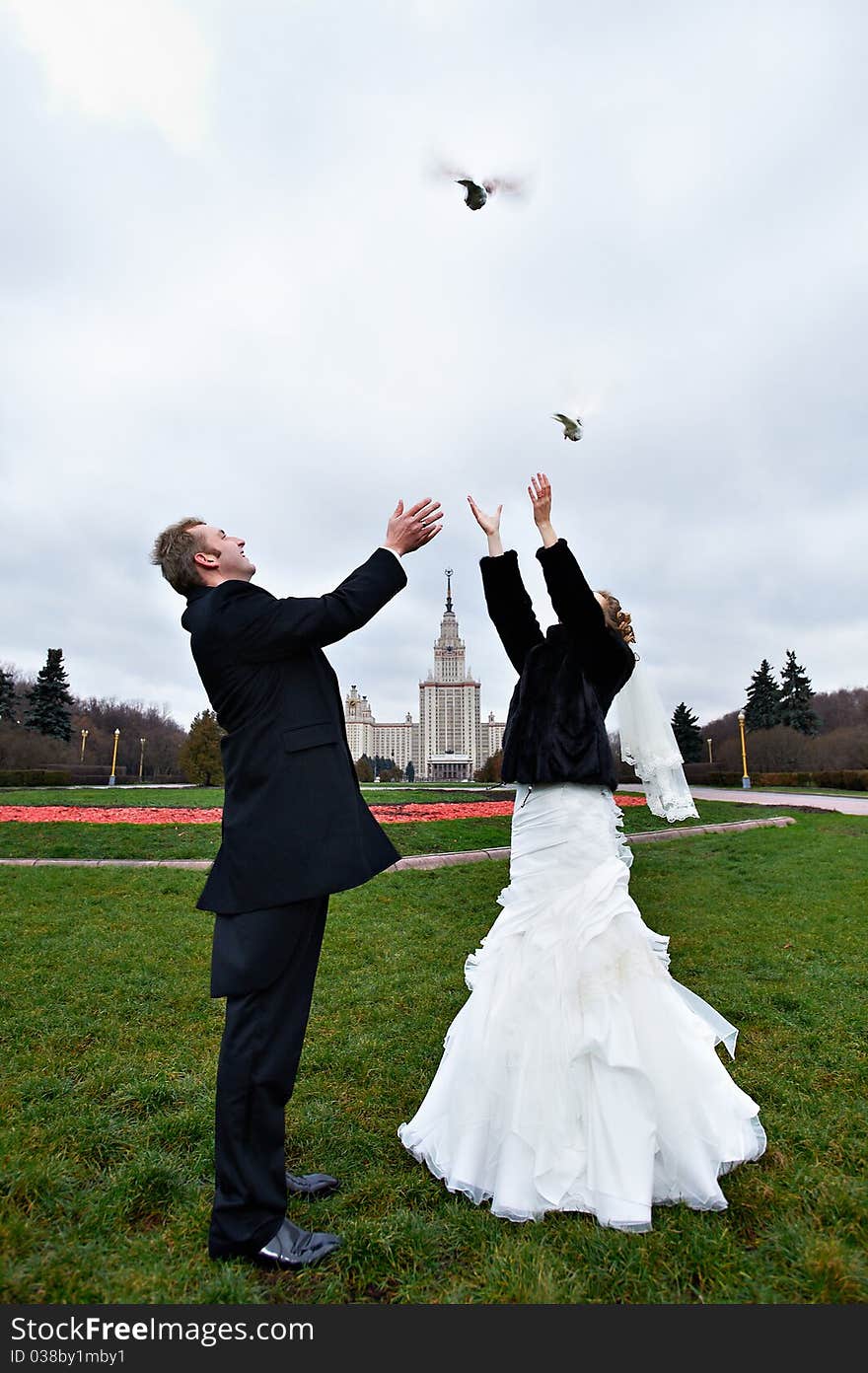 Happy Bride And Groom And Pigeons