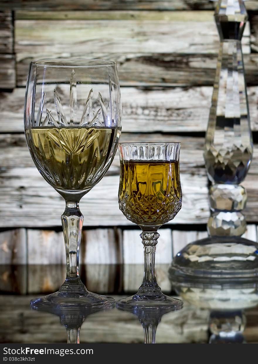 Wine glasses and cabin wall background