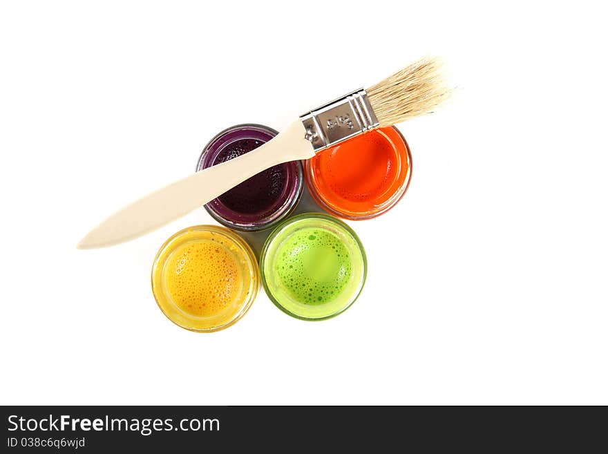 Colorful paint buckets with paintbrush on white background