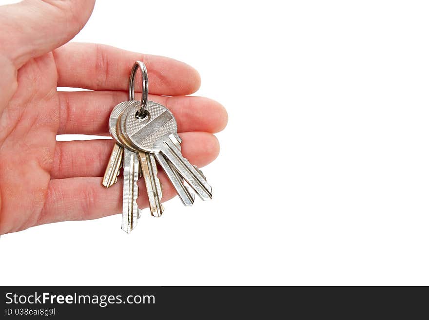 Isolated house keys in one hand