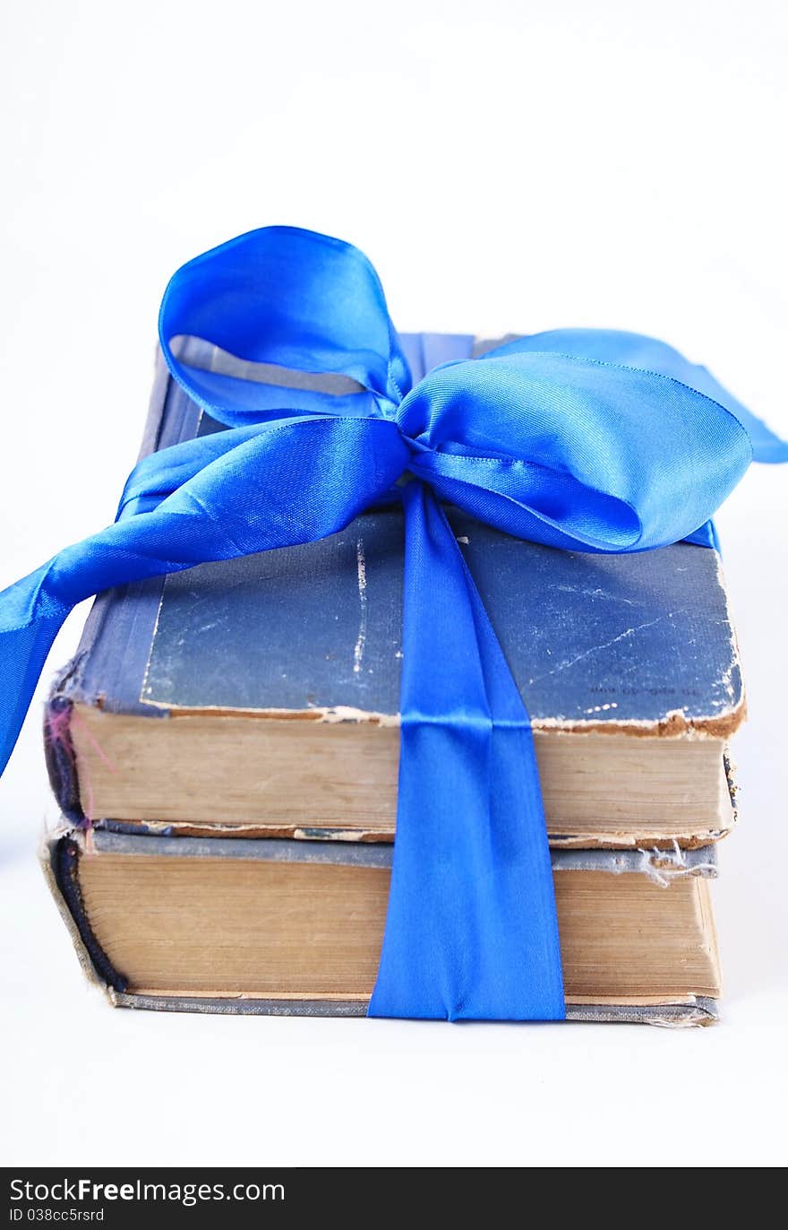 Old books with blue bow. Old books with blue bow