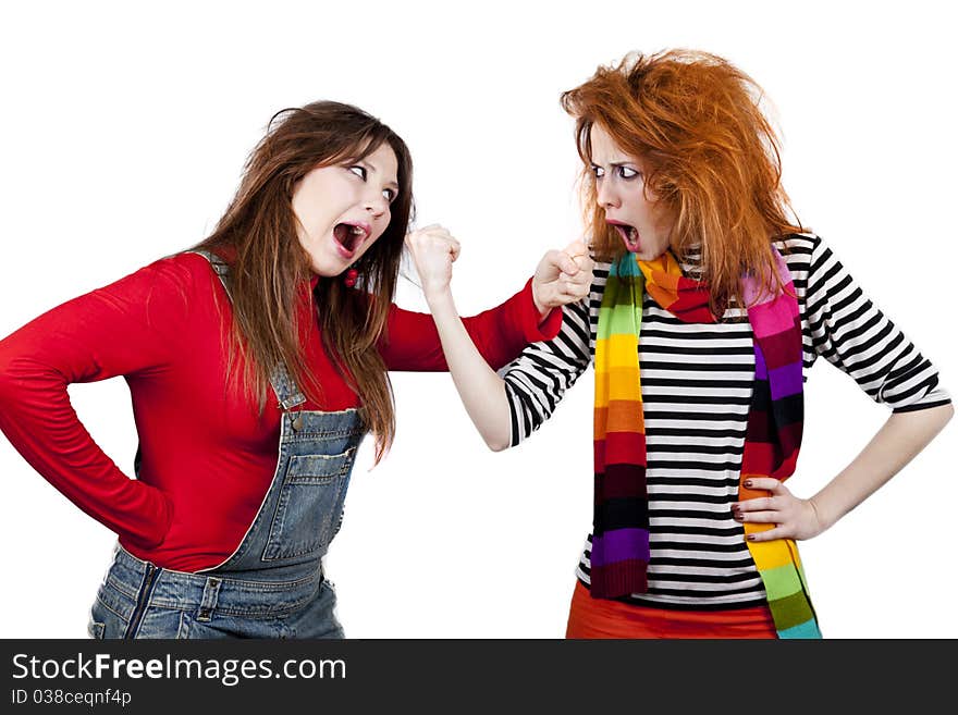 Two funny angry girls. Studio shot.