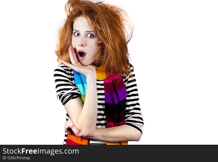 Surprised red-haired girl. Studio shot.