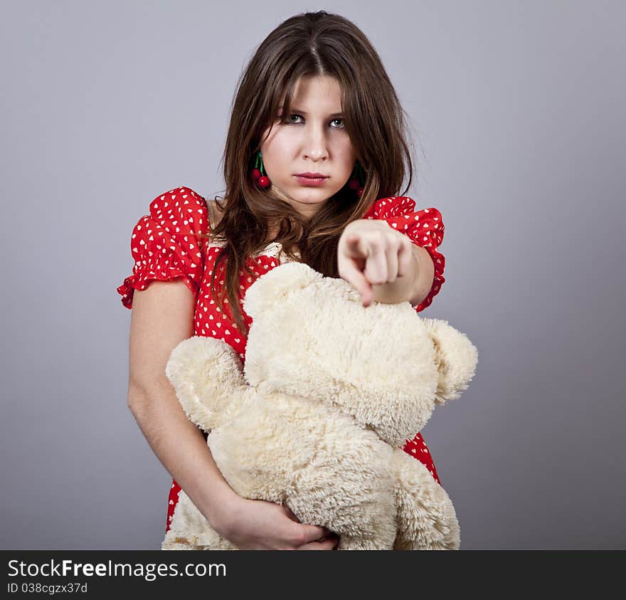 Funny girl with teddy bear. Studio shot.