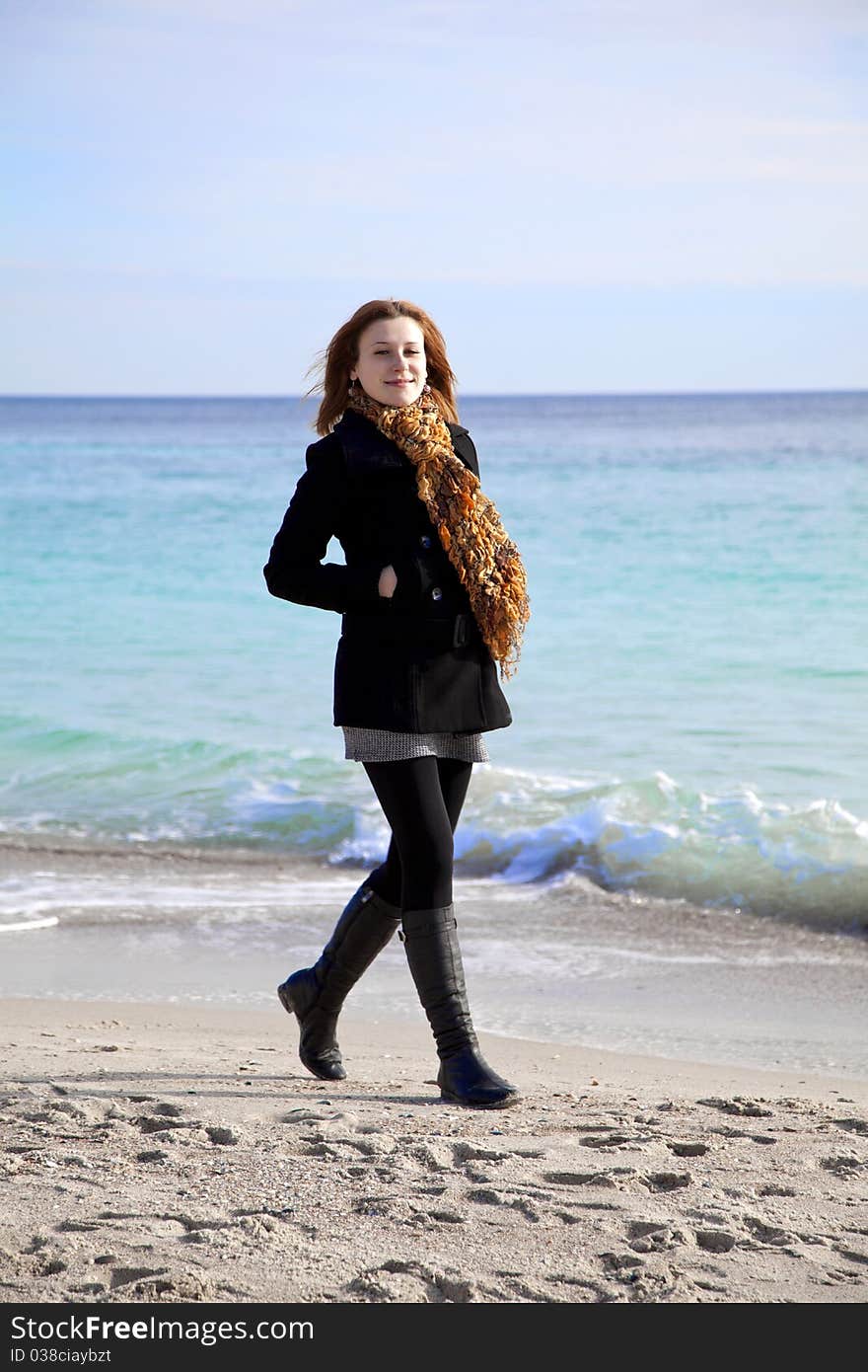 Red-haired girl at the beach.