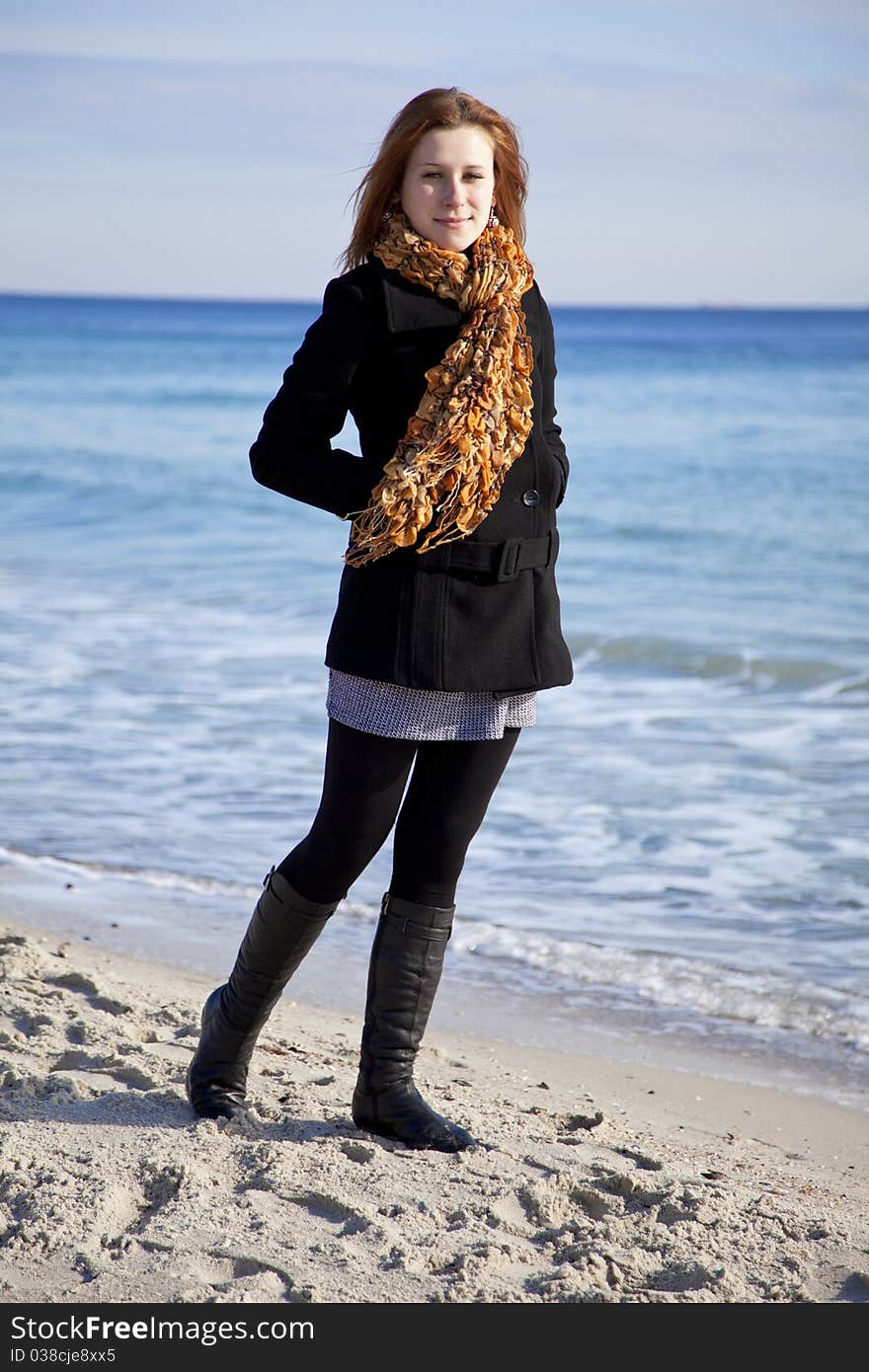 Red-haired girl at the beach.