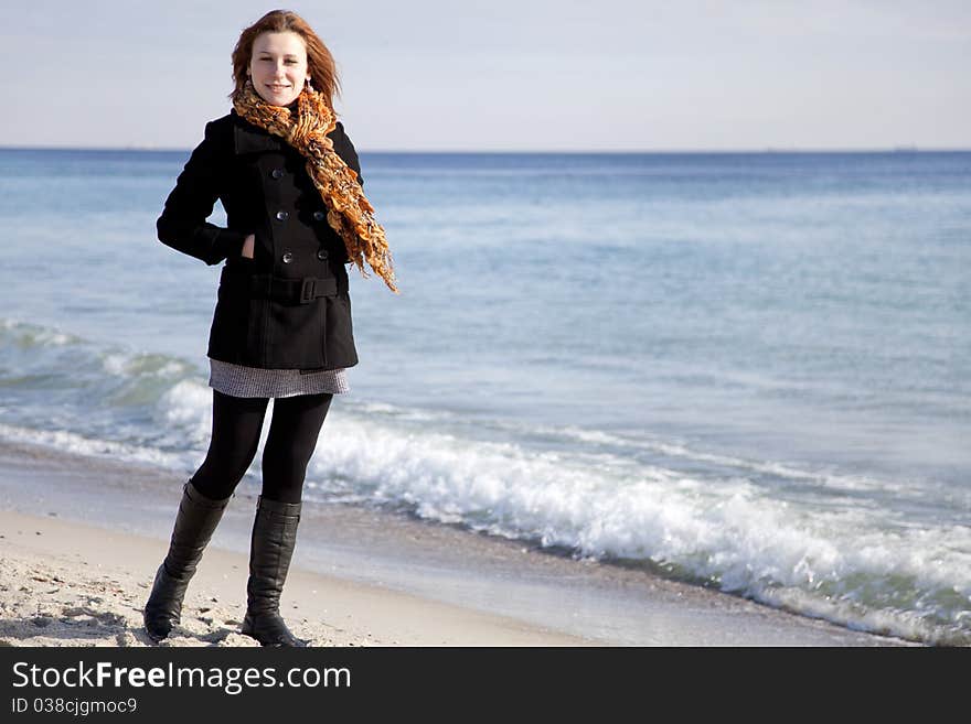 Red-haired girl at the beach.