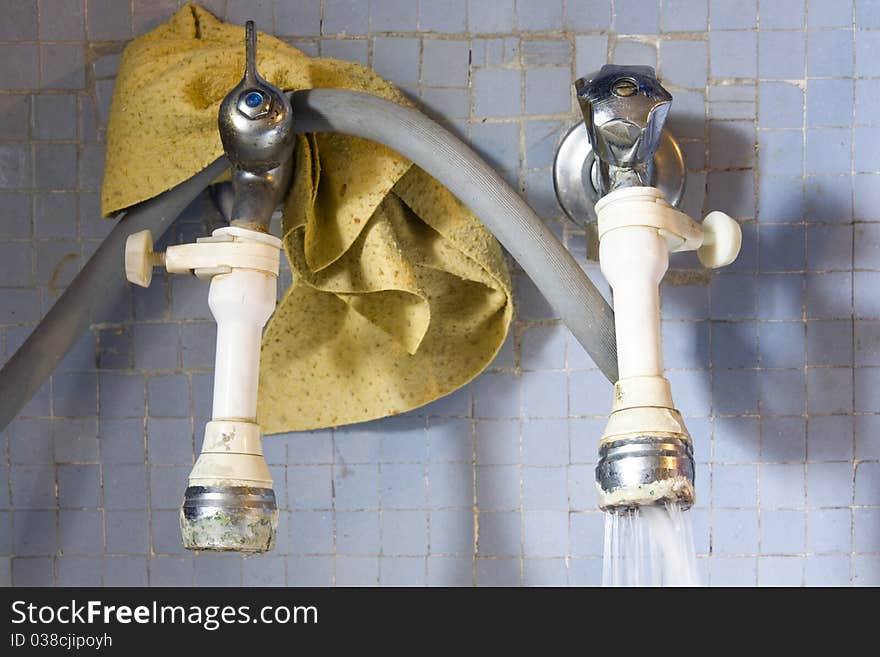 Dirty tap in the kitchen with natural light