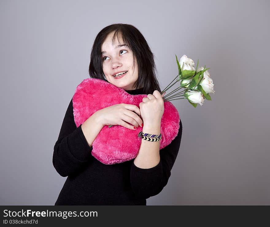 Funny gril with toy heart. Studio shot. Funny gril with toy heart. Studio shot.