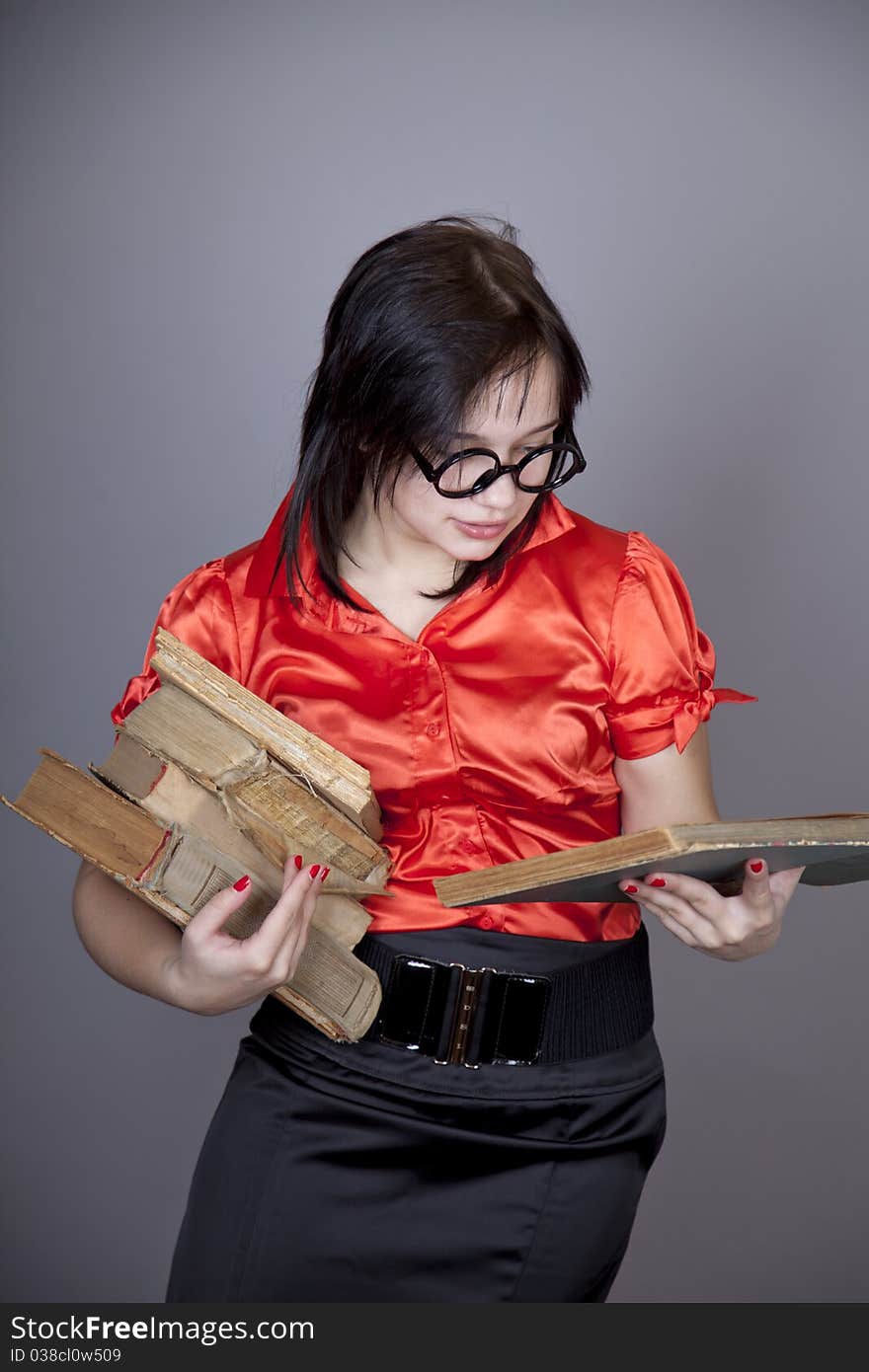 Funny teacher with books. Studio shot.