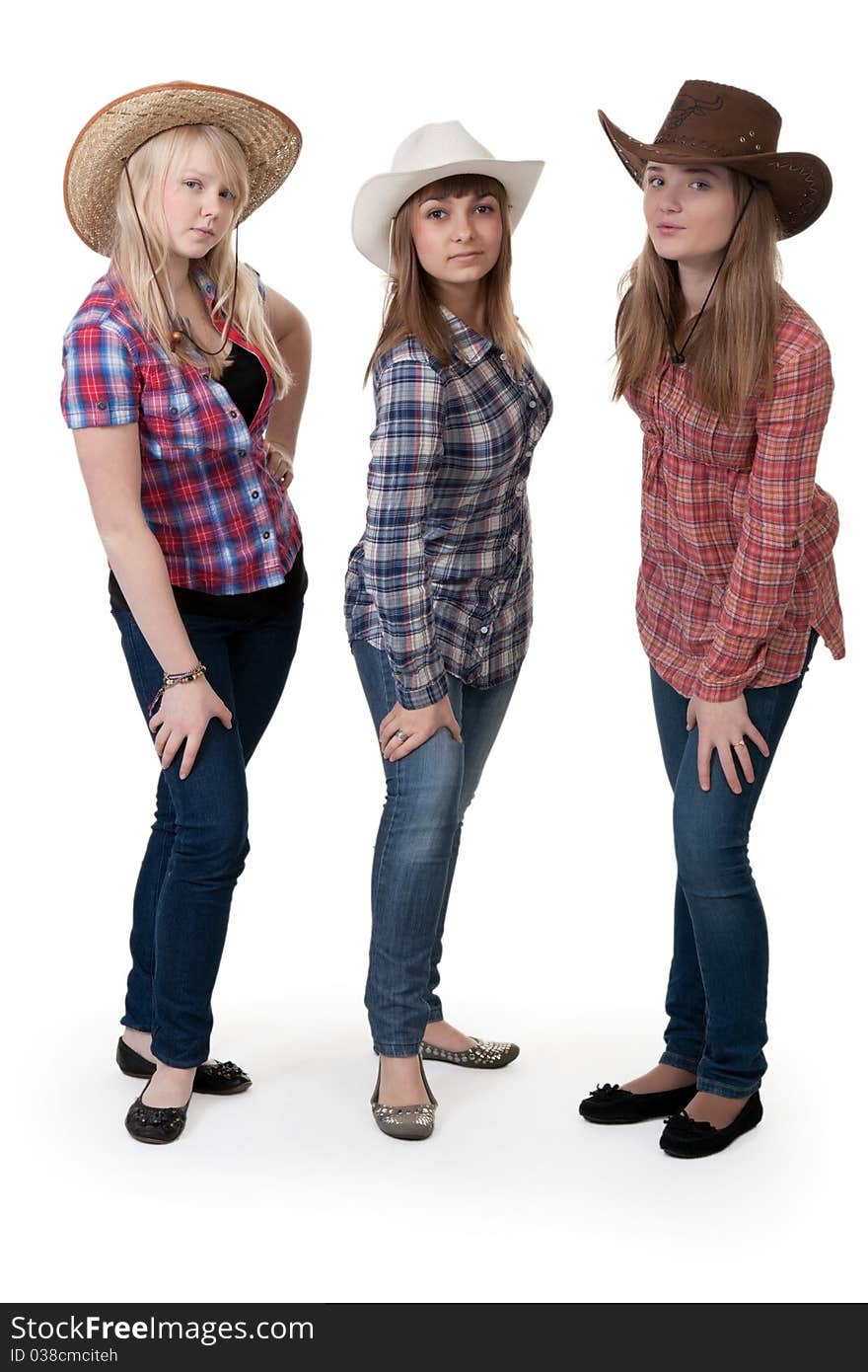 Three girls in hats on white background