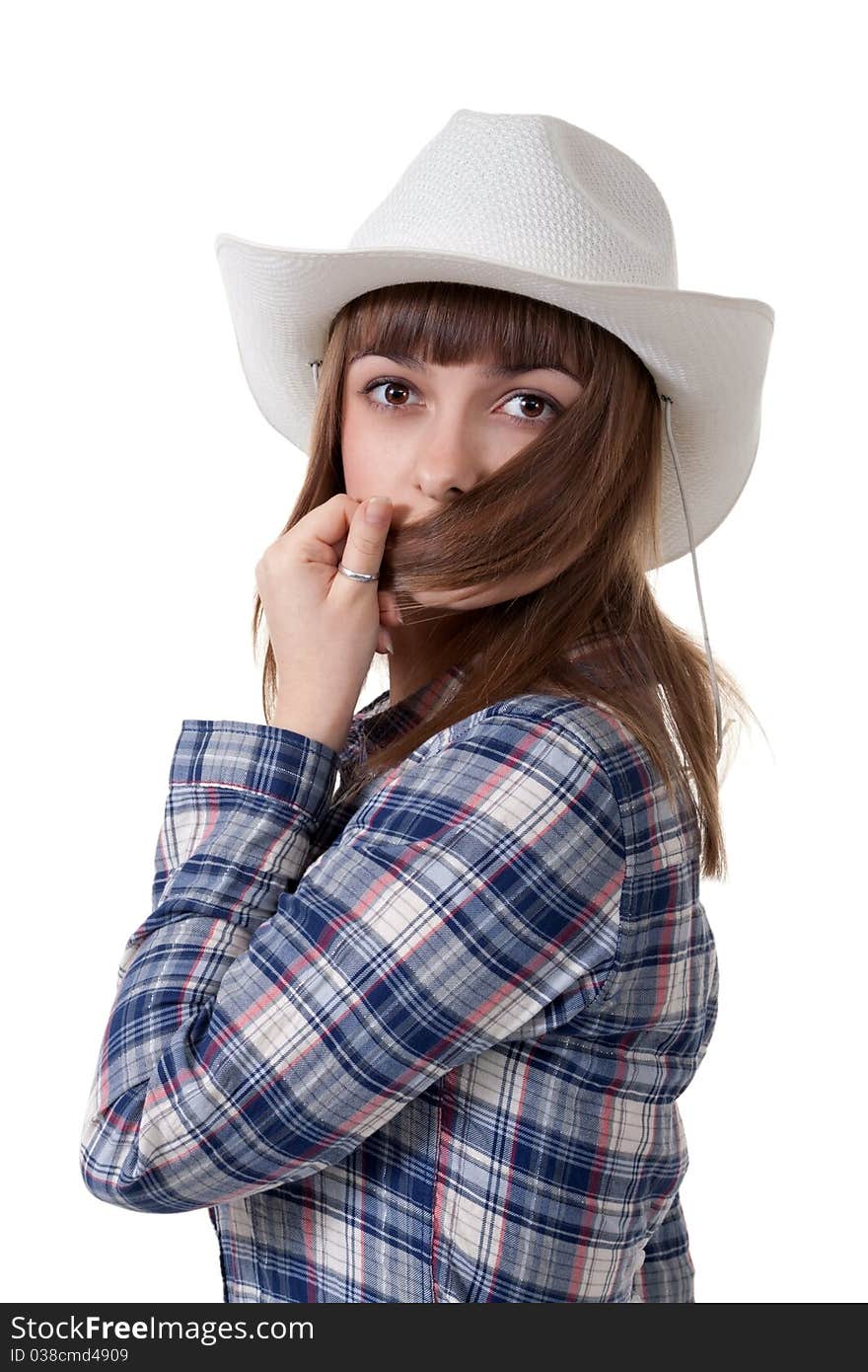 Portrait of a girl in a hat covering the face hair