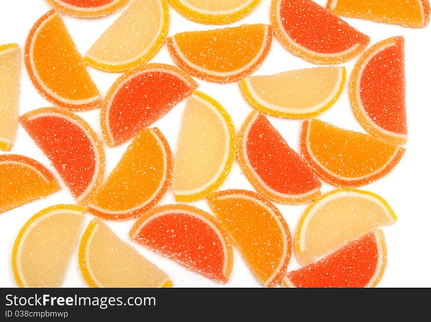 Colored jelly sweets laid on a white background