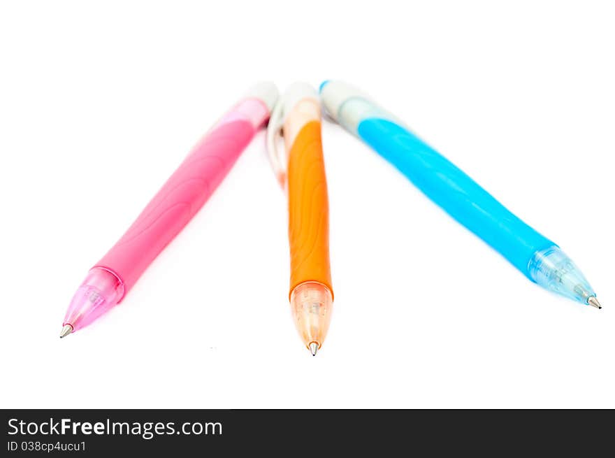 Pink, blue, orange pen on a white background