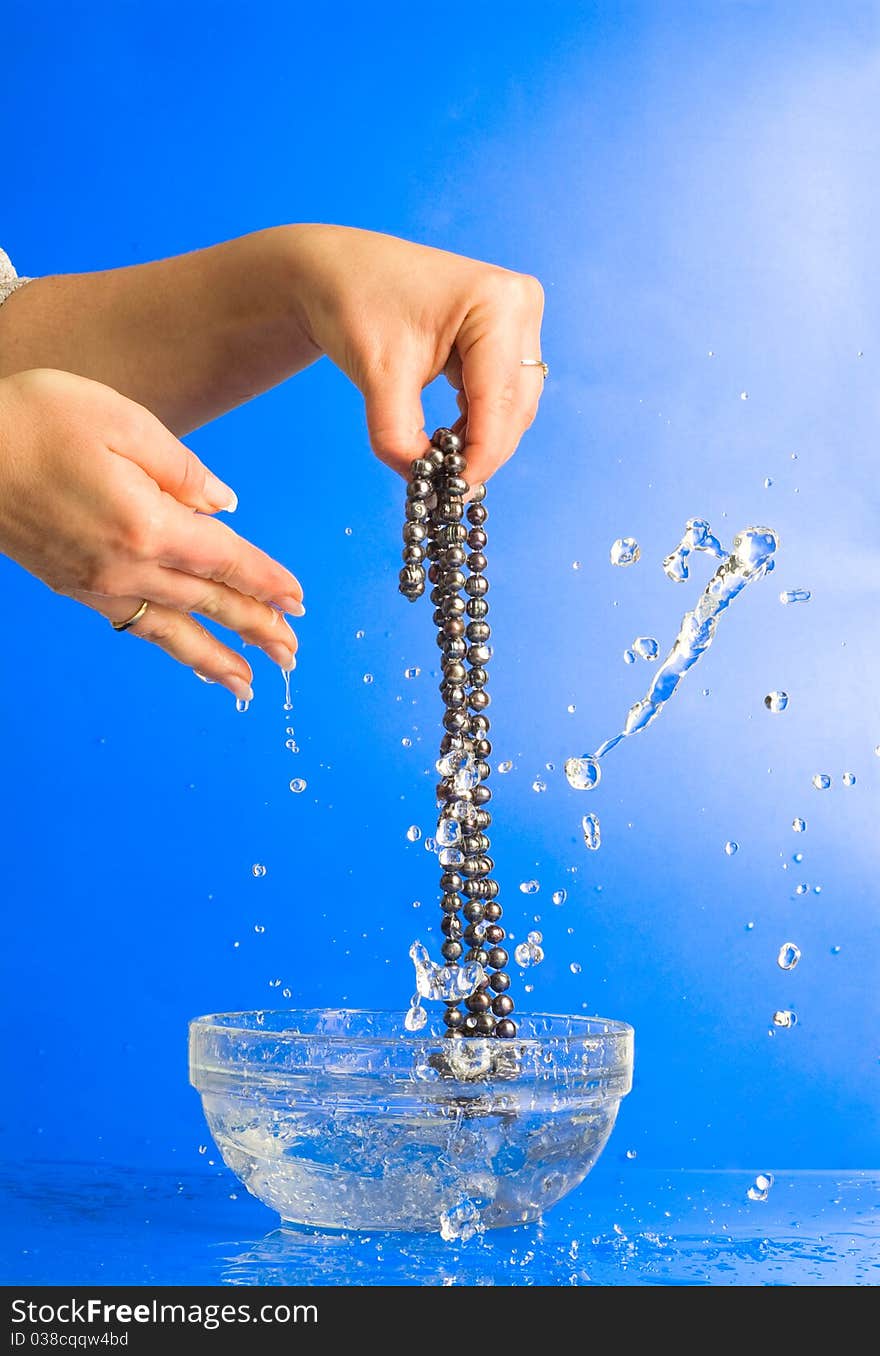 Washing beads in women's hand