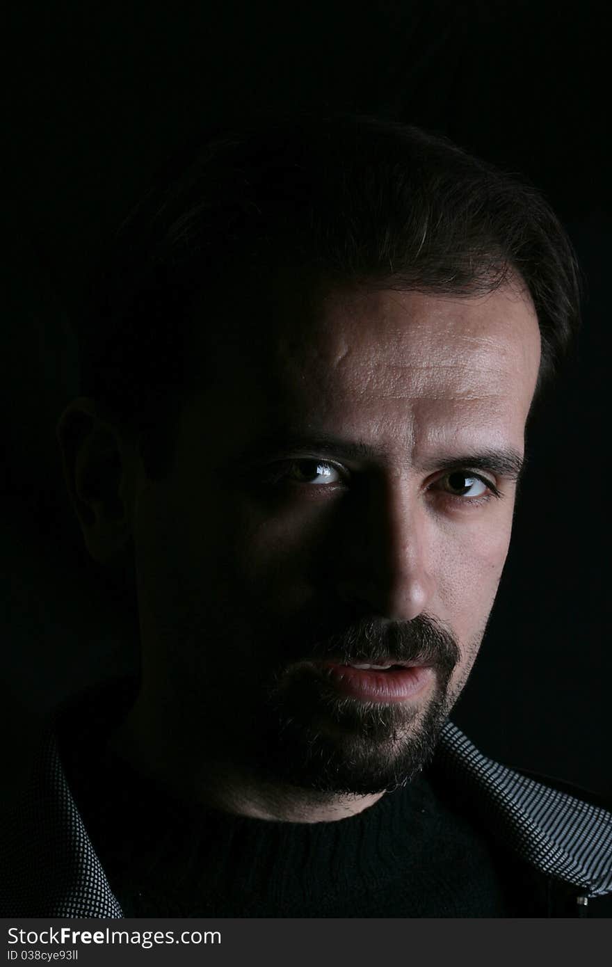 Portrait of a handsome young man on black background. Portrait of a handsome young man on black background