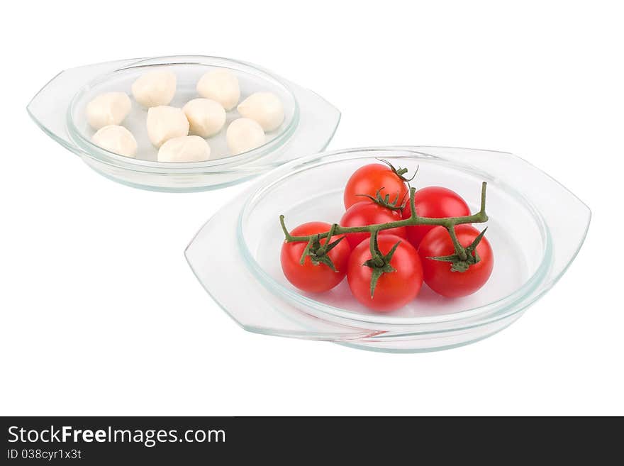 Fresh red tomatoes and mozzarella isolated on white background