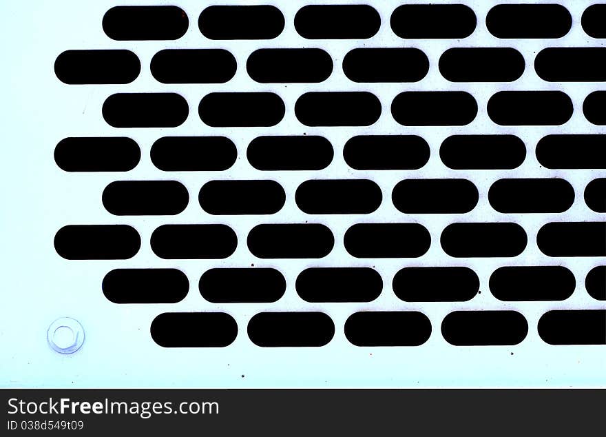 Background of metal plate with holes in blue shade. Background of metal plate with holes in blue shade