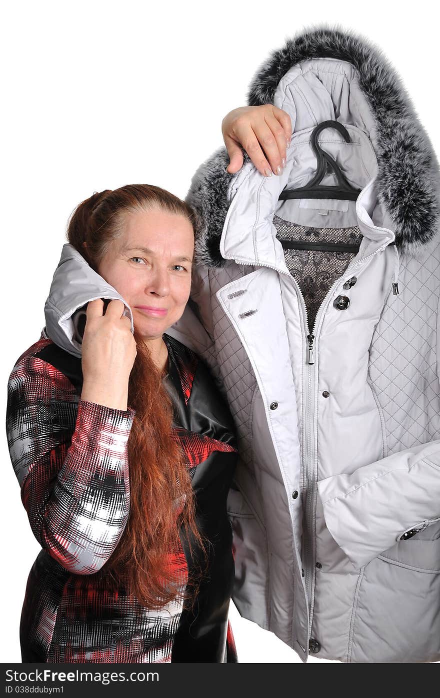 The elderly woman and new winter jacket with a fur collar. The elderly woman and new winter jacket with a fur collar.