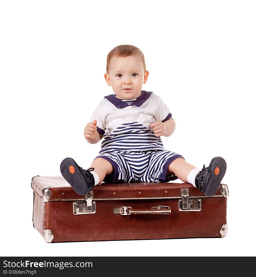 Little funny boy with suitcase isolated on white