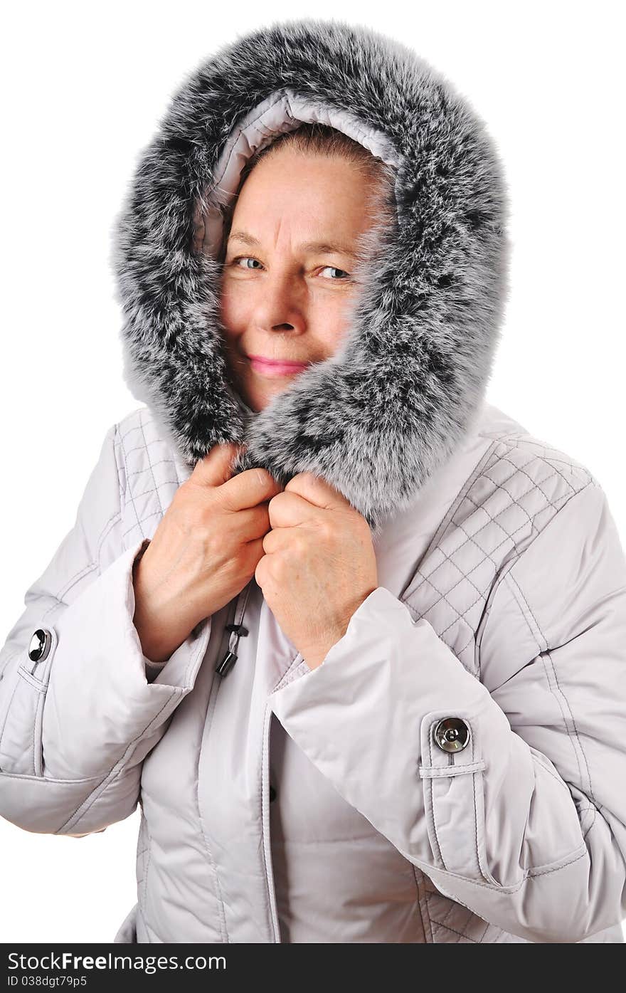 The elderly woman and new winter jacket with a fur collar. The elderly woman and new winter jacket with a fur collar.