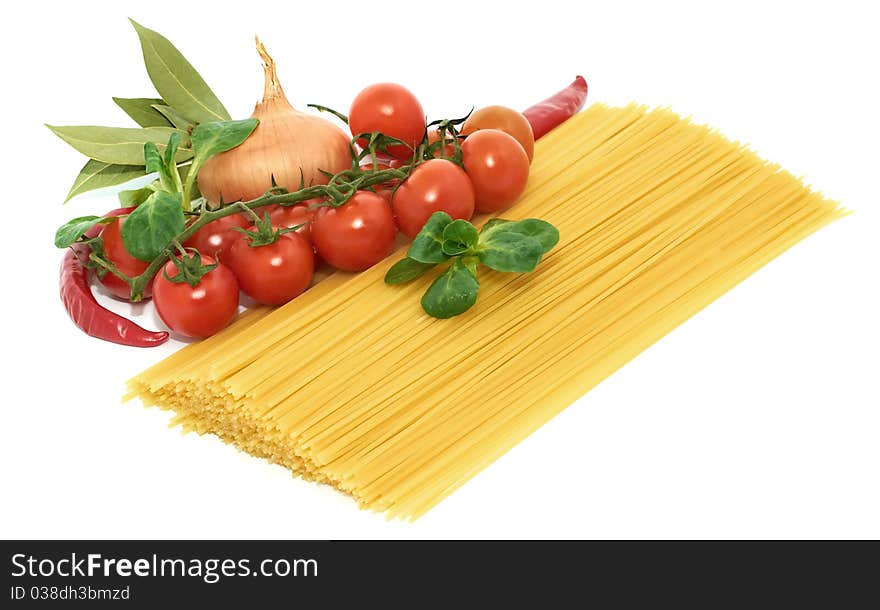 Italian pasta spagetti with vegetables on a white