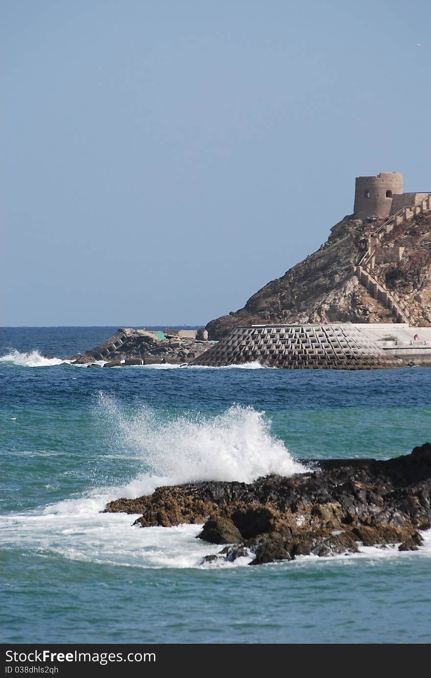 Waves crash against the coastal rocks at the port of Oman. Waves crash against the coastal rocks at the port of Oman