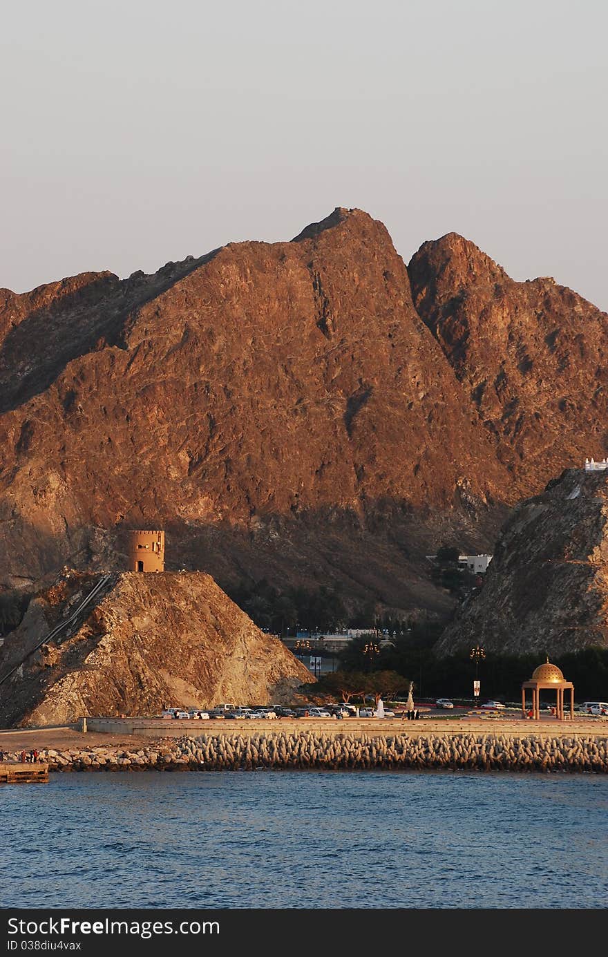 The sun begins to set over the port of Oman. The sun begins to set over the port of Oman