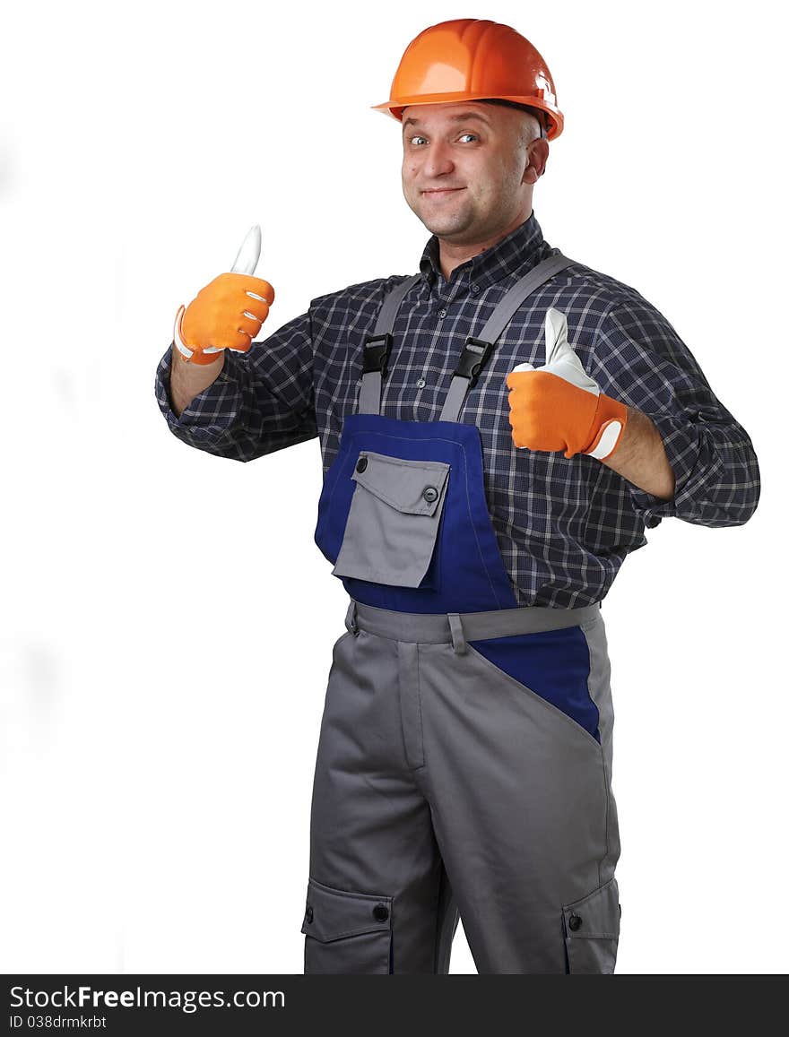 The man in the workers' clothes in a helmet on a white background. The man in the workers' clothes in a helmet on a white background