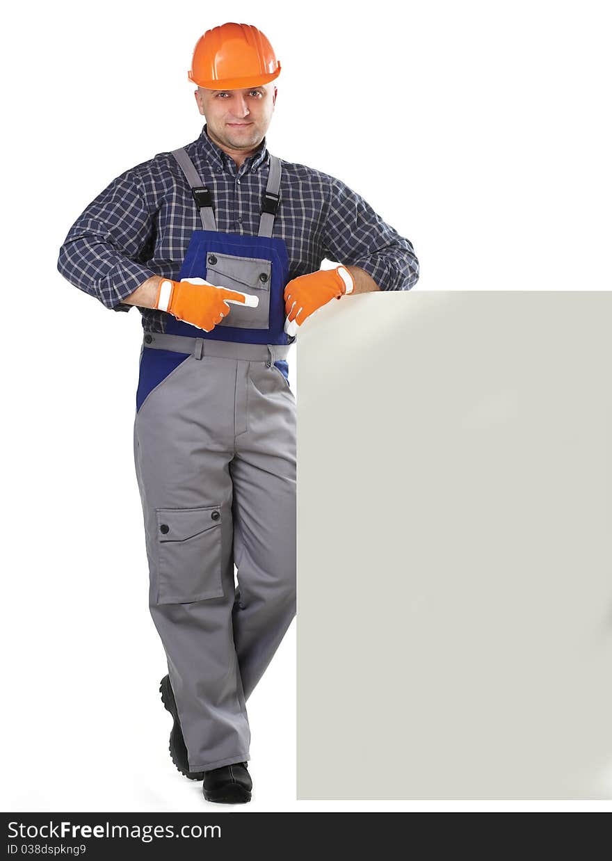 The man in the workers' clothes in 
a helmet on a white background. The man in the workers' clothes in 
a helmet on a white background