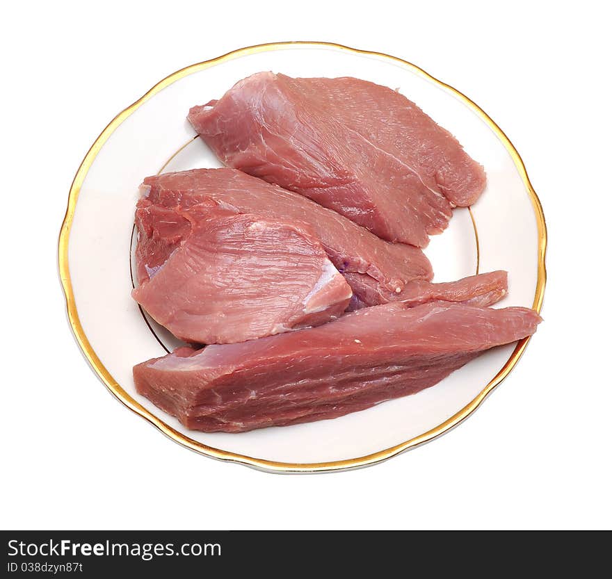 Fresh damp meat on plate insulated on white background. Fresh damp meat on plate insulated on white background