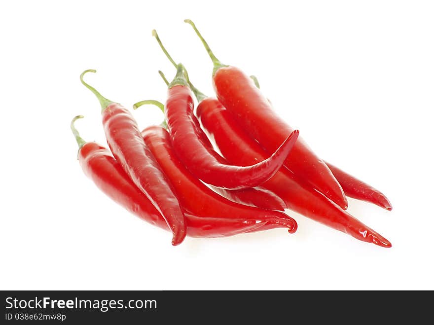 Red hot chili peppers on white background