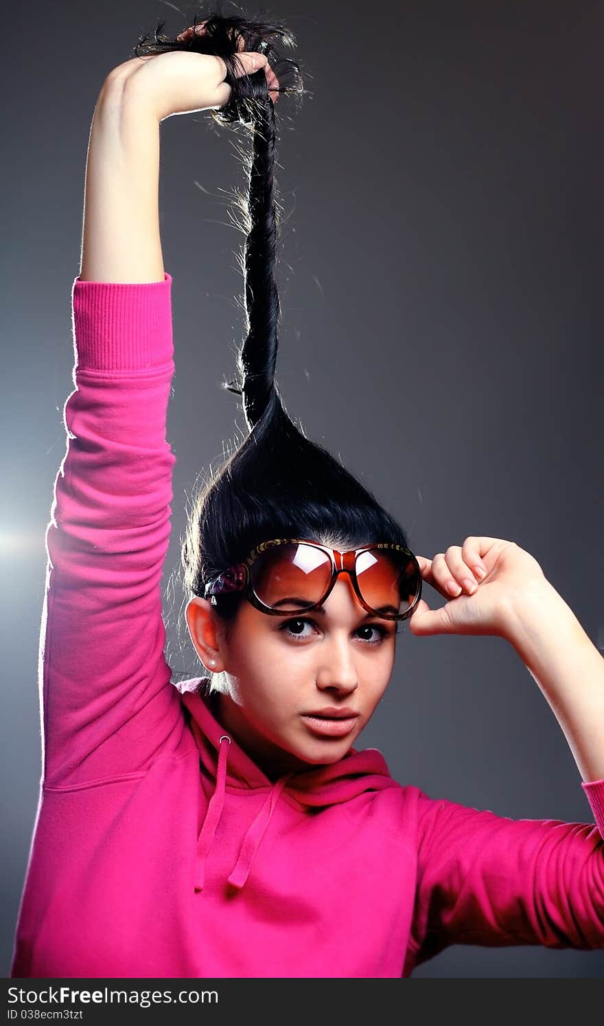 Fashion girl posing on dark background